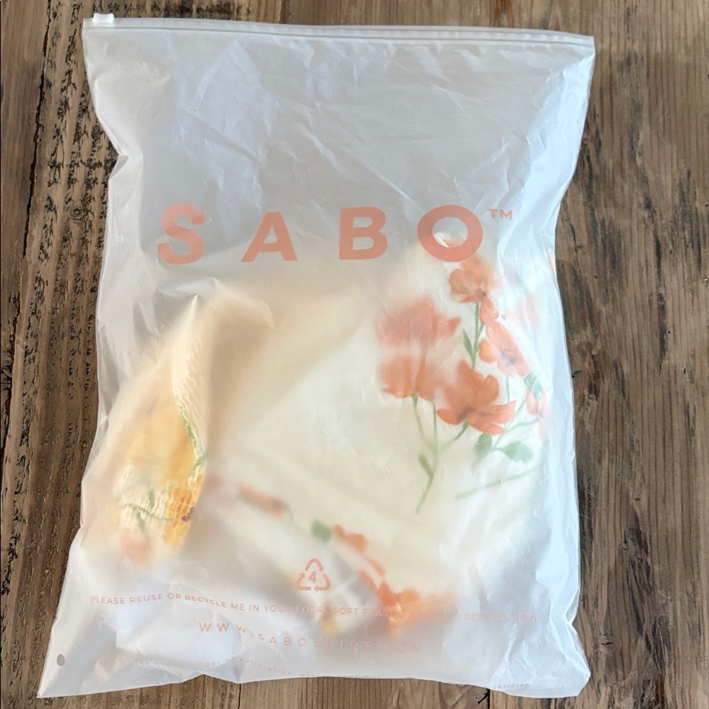 Floral Smocked Puff-Sleeve Crop Top in White with Orange & Yellow Blooms - Picture 6 of 6